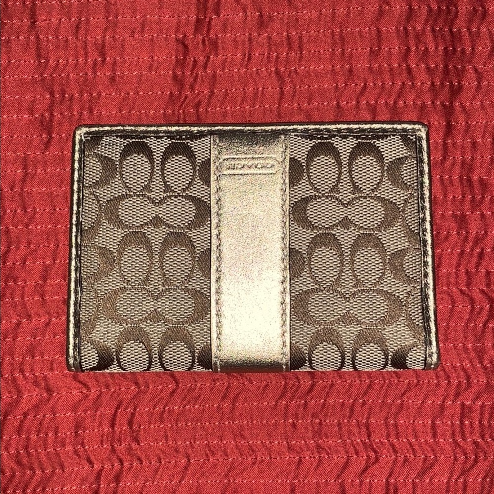 Coach gold card case. Never used.